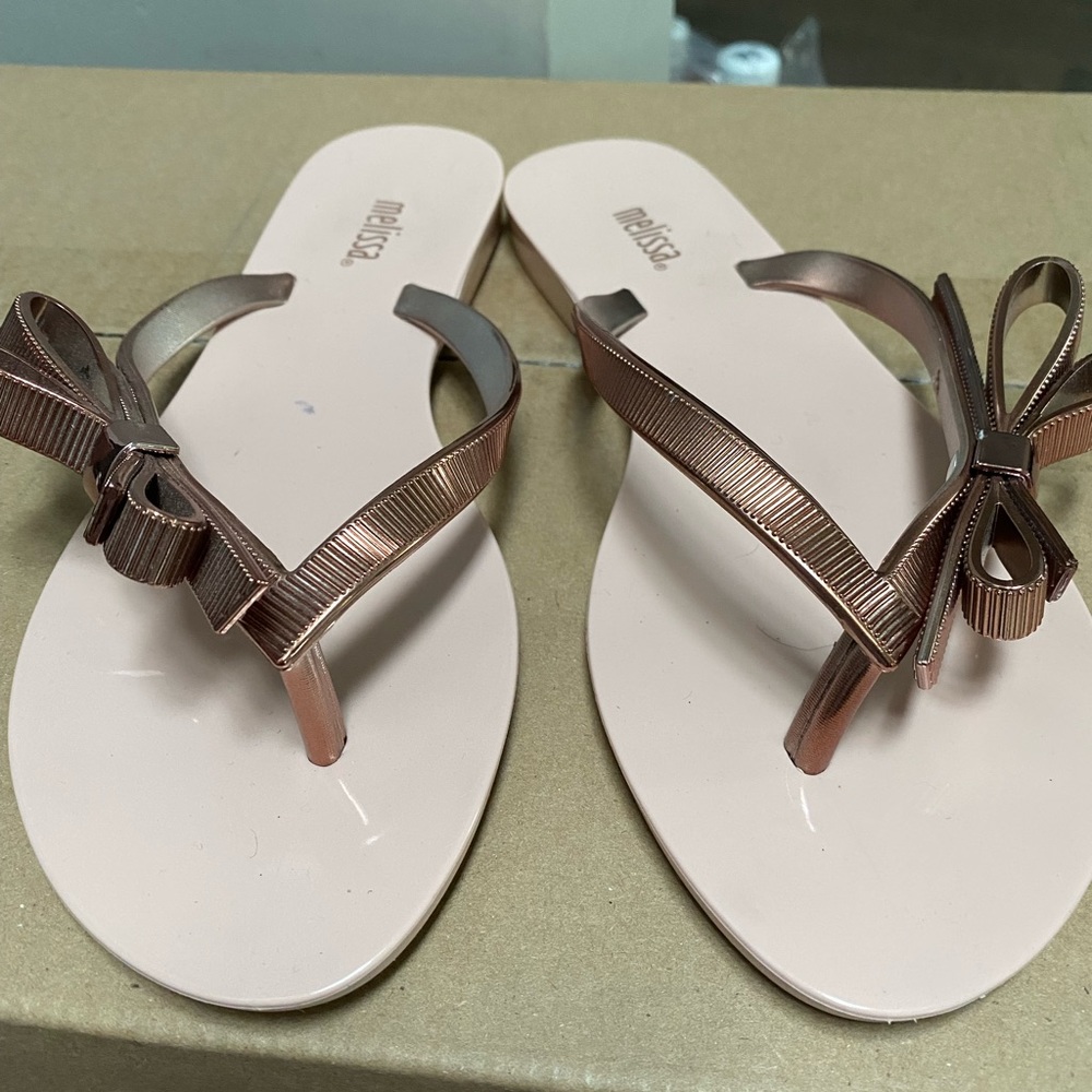 Rose gold flip flops